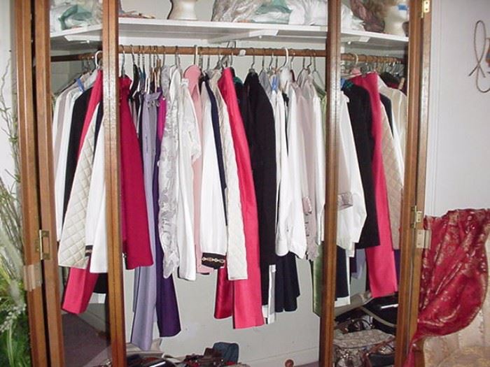 Another closet full of fashionable shirts, jackets, sweaters, etc.