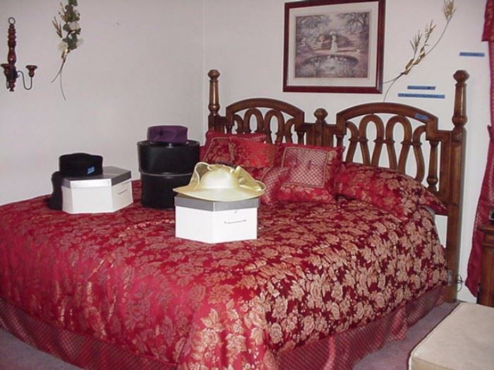 King size bed with double headboard; vintage hats and hat boxes