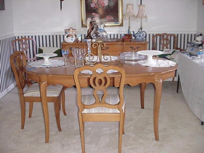French Provincial dining room  table and six chairs, light mahogany