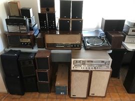 A mountain of vintage stereo equipment.
