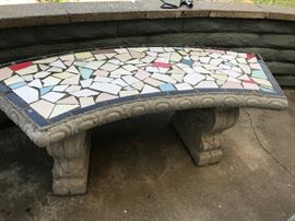 One of three benches with mosaic tile inset.