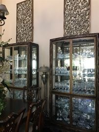 These curios are fantastic, metal frames with glass shelves and lit interior, Drexel Heritage.