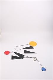 1987 Joel Hotchkiss Hanging Kinetic Mobile: A 1987 kinetic mobile by American sculptor Joel Hotchkiss (born 1949). Executed in the style of Alexander Calder, this features black metal blades and curving aluminium framing that balancing mounted fabric circles of bright red, yellow and blue, connected with narrow wire. It is signed and dated on a larger panel.
