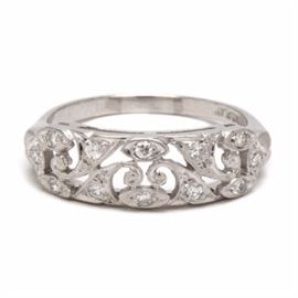 Vintage Platinum Diamond Openwork Floral Ring: A vintage platinum openwork floral ring adorned with diamonds.