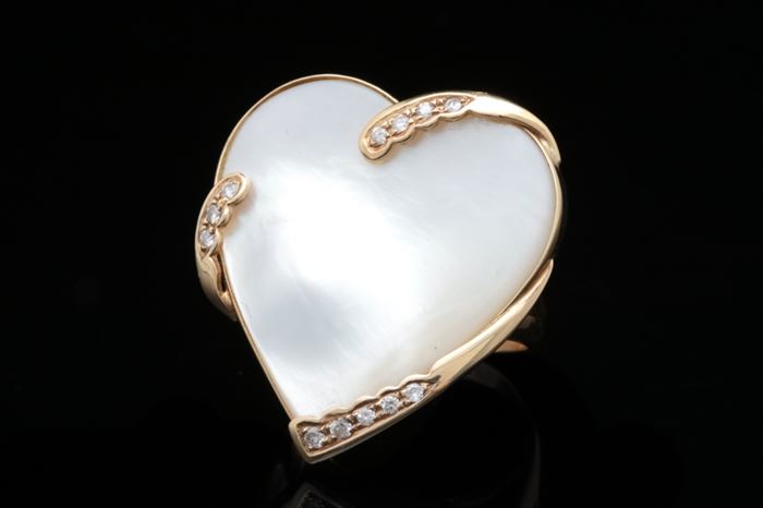 14K Gold, Blister Pearl, and Diamond Ring: A 14K gold, blister pearl and diamond ring featuring a heart-shaped blister pearl accented with twelve round brilliant diamonds with 0.16 ctw.