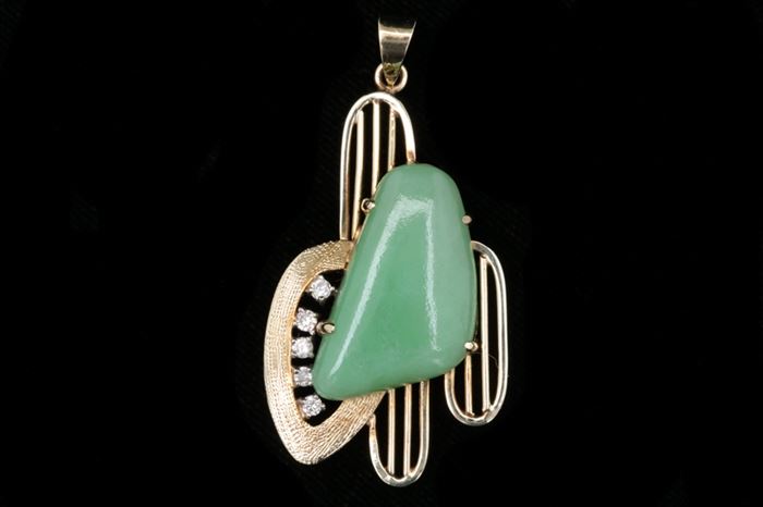 14K Gold, Jade and Diamond Pendant: A 14K gold, jade and diamond pendant with a mid century modern design consisting of a prong set jade stone accented with three 14K yellow gold lined ovals and a textured gold open shape with five round brilliant diamonds.