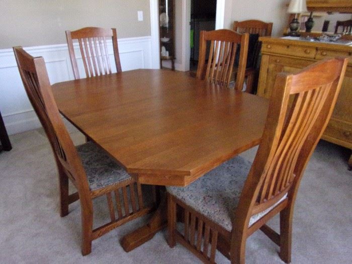 Mission style Dining room table with two leaves, 6 chairs, gear system with lock close.....antique buffet not for sale