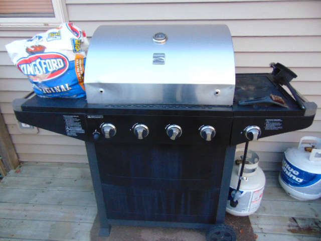 Kenmore Propane Grill with extra burner on side.  Needs a hood handle.