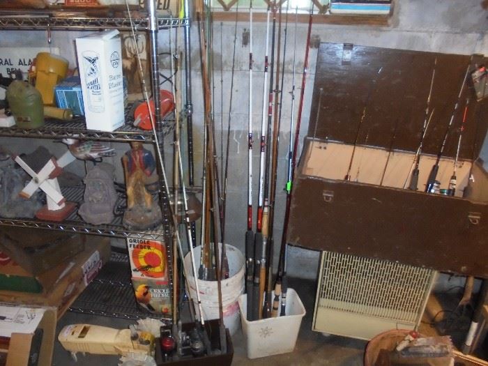Collection of fishing poles and wooden chest