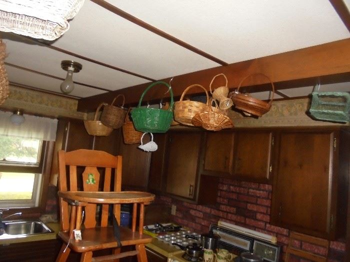 Look up in the kitchen for many baskets
