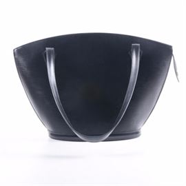Louis Vuitton Black Epi Leather St. Jacques Shoulder Bag: A Louis Vuitton Black Epi leather St. Jacques shoulder bag. This bucket-style handbag is composed of leather, and features two shoulder straps, a gold tone zip closure with an overlapping LV branded zip pull, and an embossed “LV” Louis Vuitton monogram to one bottom corner. The Louis Vuitton Paris trademark is presented to the interior; the zip pull displays date code AS1905. This purse comes complete with a Louis Vuitton retail bag.