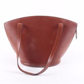 Louis Vuitton Brown Epi Leather St. Jacques Shoulder Bag: A Louis Vuitton brown epi leather St. Jacques shoulder bag. This bag features an inverted shape with the bag narrower at the base than at the top. Other features include doubled side stitched handles, a zip close top, suede lining, and a side wall zip close pocket. The bag is marked to the interior “Louis Vuitton Paris Made in France”, and to the zipper “AS0995”. Also included is a Louis Vuitton branded shopping bag.