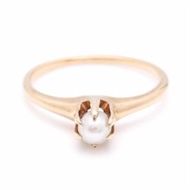 14K Yellow Gold Pearl Ring: A 14K yellow gold pearl ring. This ring features a cultured pearl with multi-prong setting.