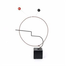 Folk Art Sculpture In the Style of Calder: A folk art sculpture In the style of Calder. This sculpture is made of metal rods. It is has a whimsical design of a face. This style is similar to the work of Alexander Calder.