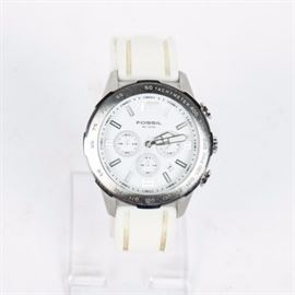 Fossil Chronograph Watch: A Fossil chronograph watch. The watch has a white dial and rubber band. It is style CH2530.