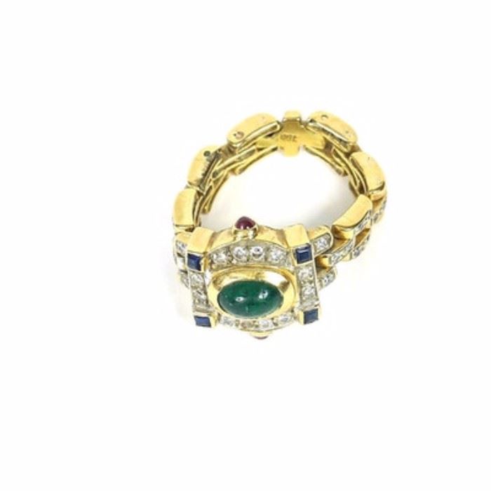 18K Yellow Gold Link Ring with Diamonds and Gemstones: A yellow gold link ring with colored gemstones. The shank of the ring is made of interlocked links, set with diamonds. The crown is set with a variety of clear and colored gemstones.