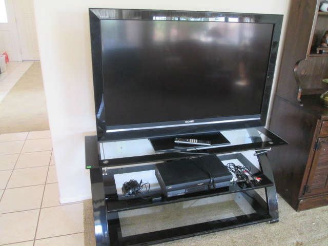 Flat Screen TV, by Sony Bravia 46" plus a nice metal and glass stand 