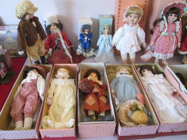 Assorted dolls resting in their boxes