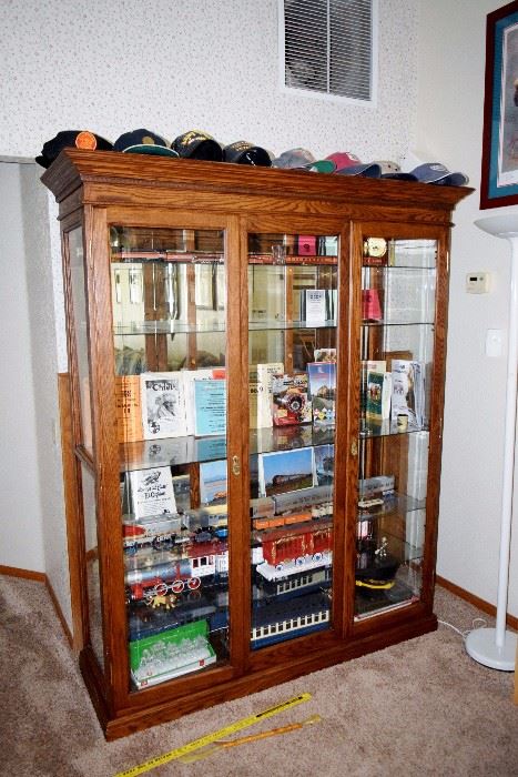 oak.china cabinet, filled with trains  ,blue comet  repro train have boxes