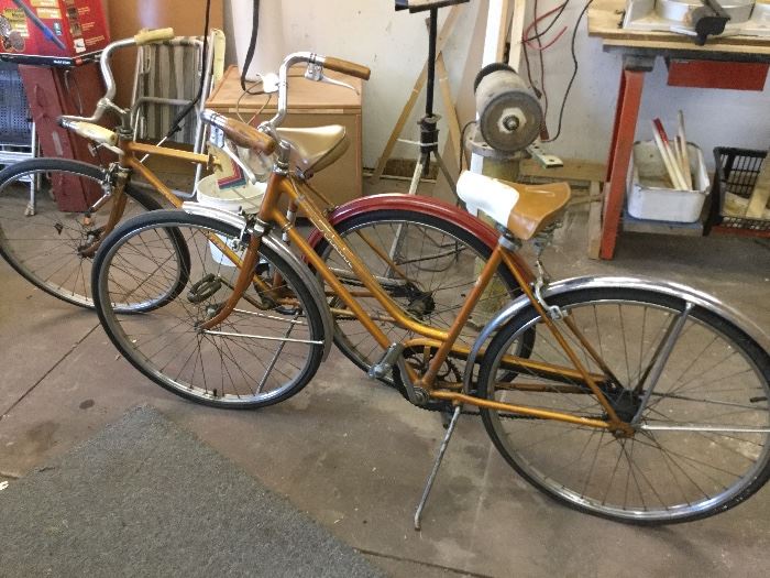pair of vintage Schwinn bicycles, partially restored