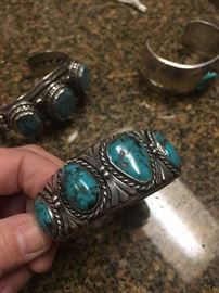 several heavy sterling native american cuffs - some signed and some not great pieces