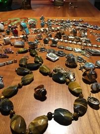 all kinds of great sterling and real stones -in this collection- tiger eye -jade- turquoise, onyx, abalone, mother of pearl, coral, and more !!