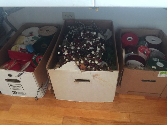 boxes of ribbons and holiday decorations