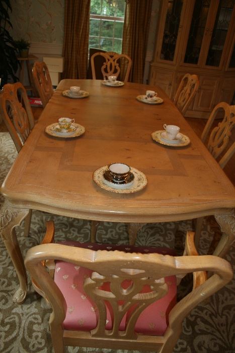 This is a 10 foot (two leaves) oak with birdseye maple inlay (Century) dining table with carved legs and an accompanying China cabinet.