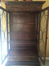  View of Curio Cabinet with doors open. Features 2 lights on top, 3 glass shelves, and a drawer on the bottom 