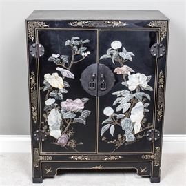 Chinese Inspired Small Chest: A Chinese inspired two door chest with applied stone decoration. The scene shows two birds sitting on floral branches. There is one branch on each door. The doors open to reveal a storage area with two shelves.
Corresponds with item 17COL113-028.