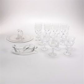Etched Glassware Serving Set: A collection of glassware. This matching collection features a total of sixteen pieces, consisting of eight cocktail glasses, six goblet glasses, a divided serving dish, and a serving platter with a handle to the center. The set shows a clear glass frame with a lightly etched leaf patterned border to the exterior. All pieces are unmarked.