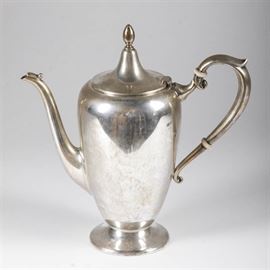 Fisher Sterling Silver Teapot: A Fisher sterling silver teapot. The vintage teapot has clean lines, with a tall, rounded body that has a hinged lid with finial, a bead detail on a graceful spout, and white ring accents on the handle. The underside is marked “FISHER”, with the number “9432” and a hallmark depicting a shield, crown and cursive letter “f”, along with other faint marks. Total approximate weight, inclusive of non-metal materials, 11.370 ozt.