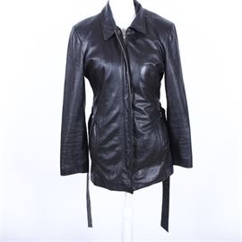 Women's Wilson's Black Leather Thinsulate Jacket: A women’s Wilson’s black leather Thinsulate jacket. This collared jacket features a hidden zipper front with a quilted Thinsulate lining and a waist belt. It is a size medium and features a maker’s label to the interior.
