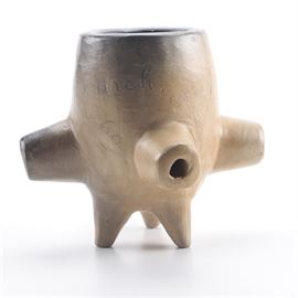 Ellie Arch Cherokee Multi-Stem Clay Pipe Bowl: A Cherokee multi-stem clay pipe bowl by Ellie Arch. This round clay pipe bowl has four stems, and a three-footed base allowing it to stand freely. The piece is marked “Made by Ellie Arch. Cherokee NC” in the clay and “60” on the surface.