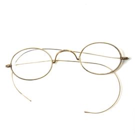 Vintage J. C. H. & Co. Reading Glasses: A pair of vintage or antique J. C. H. & Co. reading glasses with gold plated frames. The glasses have oval shaped lenses held in gold plated wire frames. The back of the nose bridge is marked “J. C. H. & Co.”