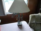 Sothwestern metal art lamp. Another matching lamp is not shown.