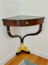 Corner table with dolphin carved feet