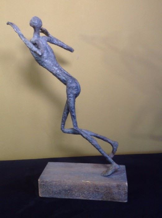 Metal and wood sculpture of a running form. Unsigned. 