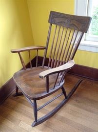 Wood rocking chair with pressed wood design