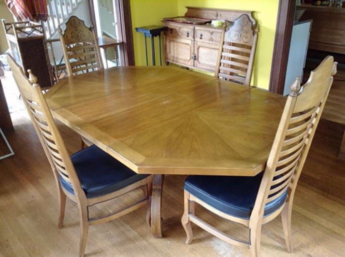 French Provincial style dining room table with four stenciled ladder back chairs