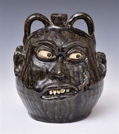 Lanier Meaders double face jug, bid online at www.fairfieldauction.com