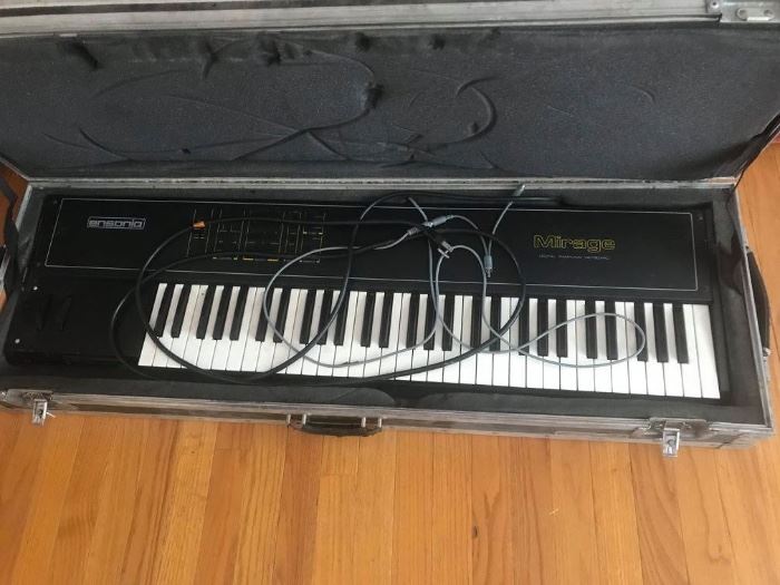 #49 Ensonic Mirage keyboard in case w/ stand $200
