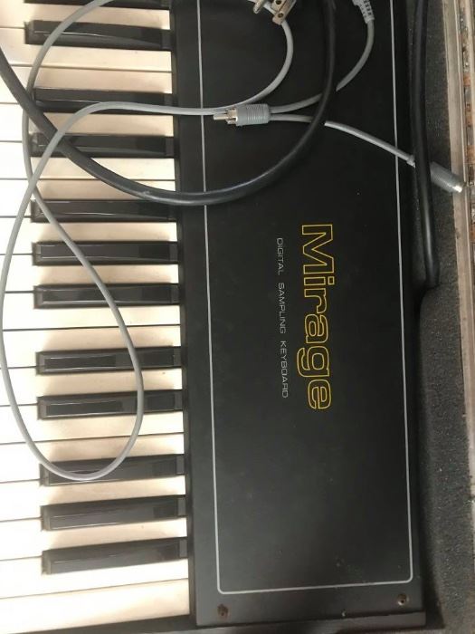 #49 Ensonic Mirage keyboard in case w/ stand $200
