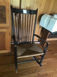 #25 black rocking chair w/ cane seat $ 75