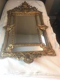 #43 Gold Bevel mirror with wood design on top and bottom 26x51 $150
