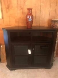 #26 Entertainment Center with glass doors 50x17x40 $120
