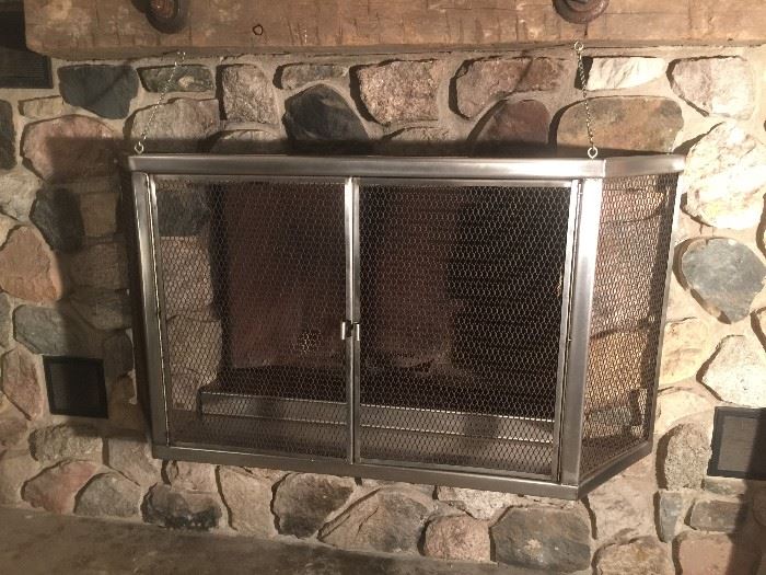 Custom build Stainless Steel Fireplace screen for stone fireplace. Screen was built to fit a 45" wide by 30" high opening. However, it will fit a 60" wide by 30 inch high opening. A remarkable one of kind screen