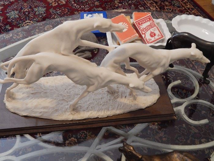 "Racing Greyhounds" by A. Belcari for Capodimonte. White Bisqueware on wood