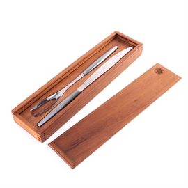 Carving Set: A carving set. This carving set from Denmark features a rectangular storage box with removable lid and includes one carving knife and one carving fork, both made of stainless steel. Pieces are marked.