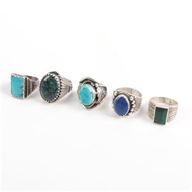 Sterling and Stone Rings Featuring Turquoise: A collection of sterling and stone rings. This collection includes five cocktail rings with turquoise, malachite, and lapis stones. The total weight, inclusive of all materials is 2.830 ozt.